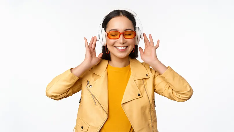 An image of a woman wearing noise-cancelling headphones