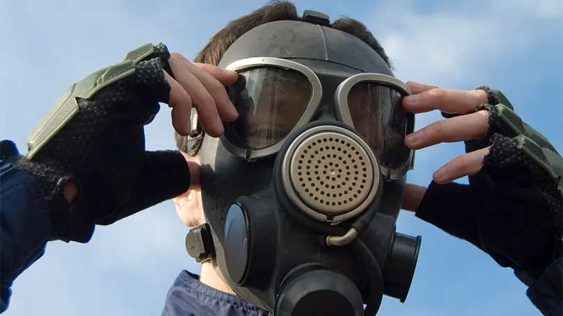 An image of a person wearing a mask to protect themselves from dangerous chemicals