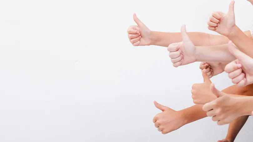 An image of a bunch of people giving a thumbs up