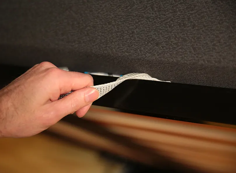 a fabric pull handle for opening the ottoman bed