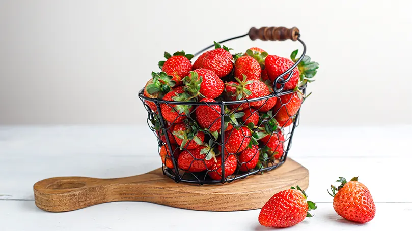 An image of strawberries in a basket.