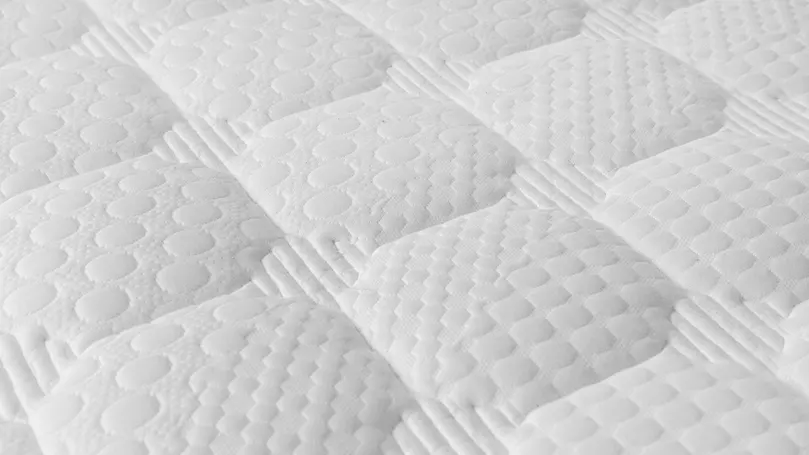 An image of a mattress up close