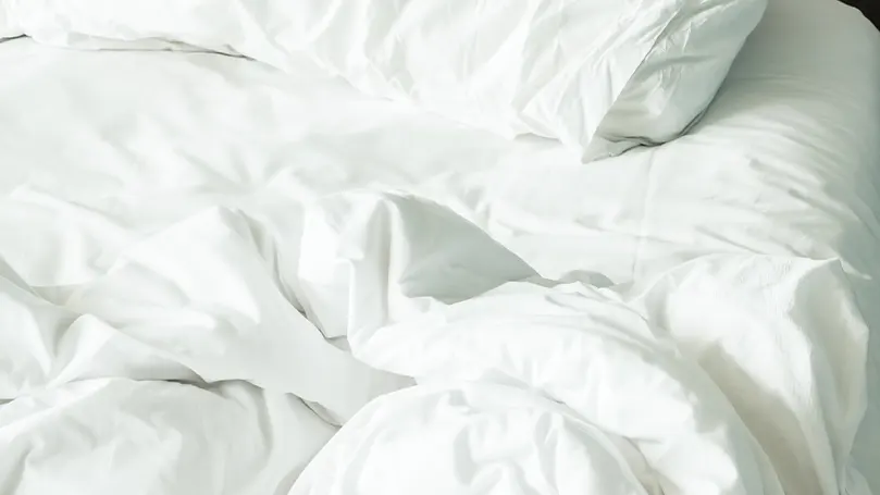 An image of white bed sheets