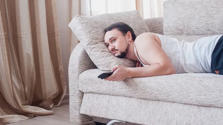 An image of a man on couch watching tv