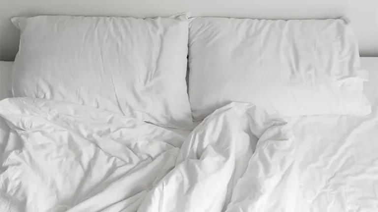 An image of bed sheets on bed with pillow and duvet