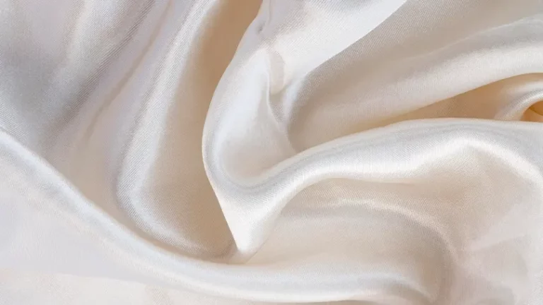 A close up image of silk sheets