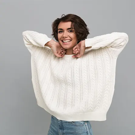 A young woman in a sweater