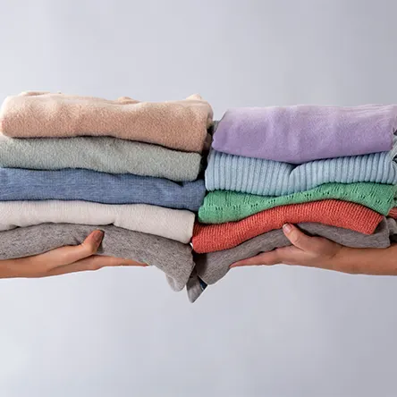Folded towels of different colours