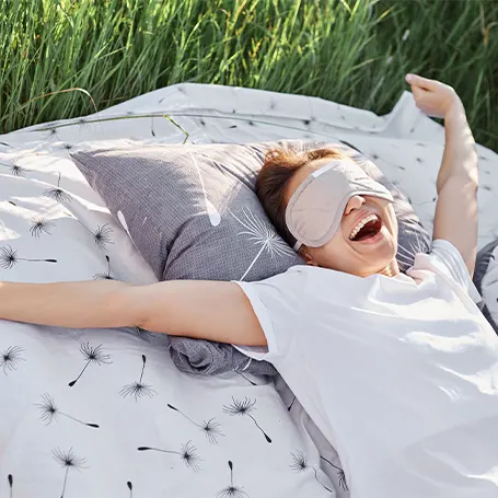 An image of a person waking up in nature