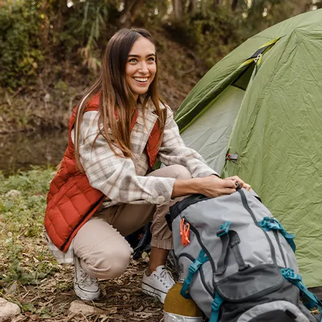 A girl setting up camp