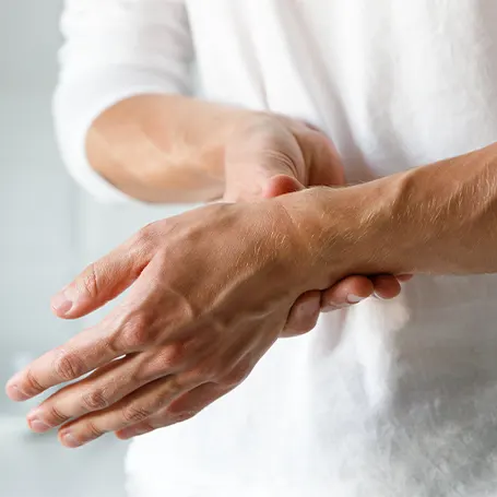 An image of a person with arthritis pain in their hands
