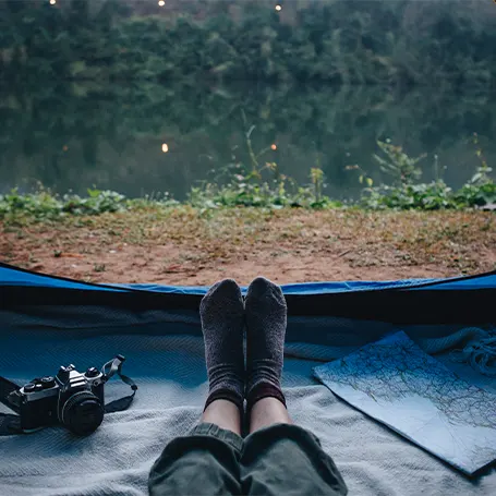 An image of a person laying in a camping tent