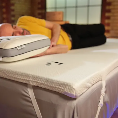 Sleep Advisors presenter sleeping on Panda mattress topper
