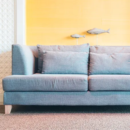 An image of a comfortable blue sofa bed
