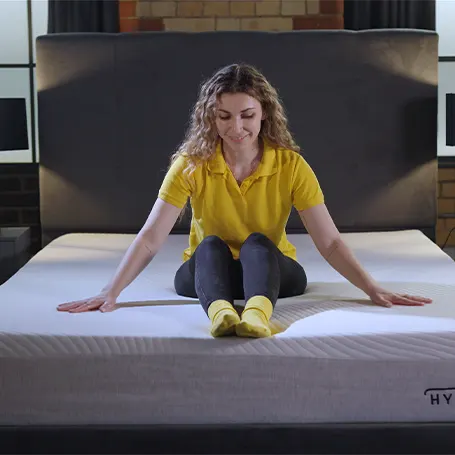 Person sitting in the middle of the mattress.
