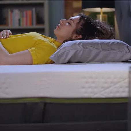 Image of the TSA reviewer Connie sleeping on the Emma Luxe Cooling Mattress
