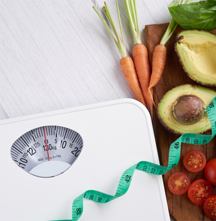 An image of healthy food and a scale