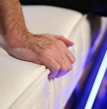 An image of a person checking the mattress firmness