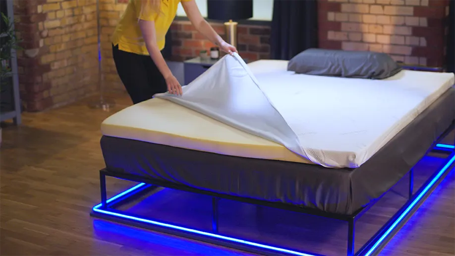 Our reviewer unzipping the silentnight impress memory foam mattress topper