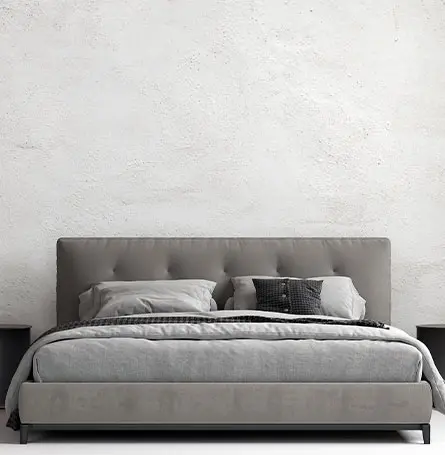 An image of a divan bed with a headboard
