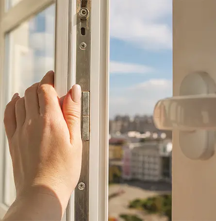 An image of a person opening up a window