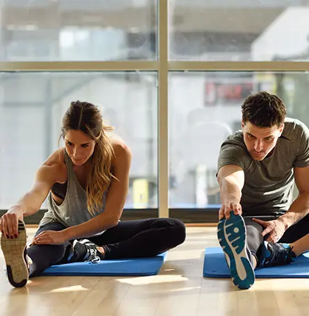 An image of two people working out slowly