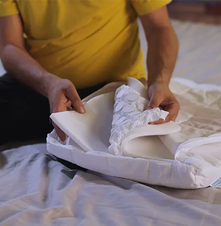 Presenter looking at the Aerocoil springs encased in Simba Pure Foam. 