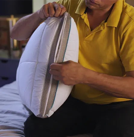 Reviewer unzipping the pillow.