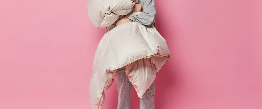 Woman holding duvet