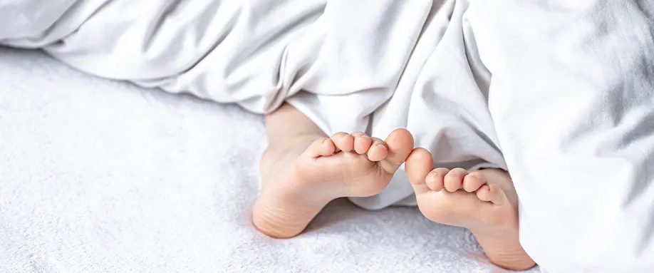 Feet poking out of duvet