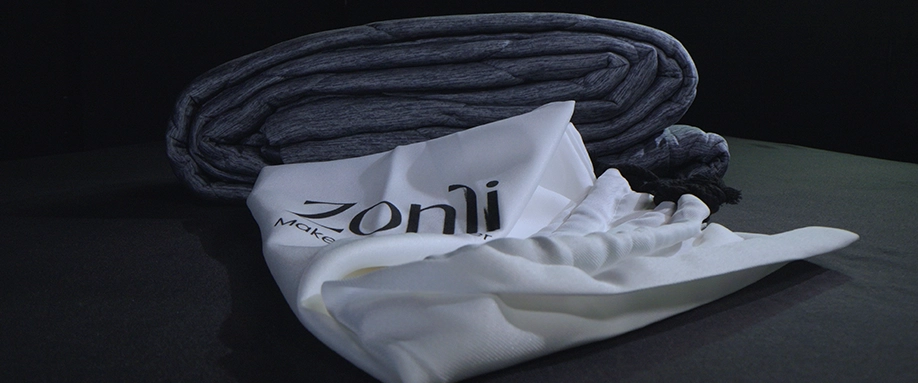 Z-Magic Cooling Comforter folded with packaging.